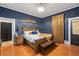 Spacious bedroom with hardwood floors and built-in shelving at 26 Oak St, Roxboro, NC 27573