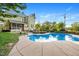Large kidney shaped pool in backyard with home visible at 26 Oak St, Roxboro, NC 27573