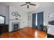 Bedroom with hardwood floors, fireplace, and built-in storage at 26 Oak St, Roxboro, NC 27573