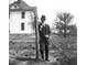 Black and white photo of a Personal in a suit and hat at 26 Oak St, Roxboro, NC 27573