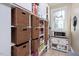 Well-organized pantry with wicker baskets and shelves at 26 Oak St, Roxboro, NC 27573