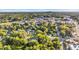 Aerial view of a town with lush green trees and buildings at 26 Oak St, Roxboro, NC 27573