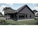 Modern farmhouse design with covered patio at Lot 5 Joyful Creek Trl, Zebulon, NC 27597