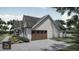 Modern farmhouse design with attached garage at Lot 5 Joyful Creek Trl, Zebulon, NC 27597