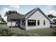 Modern farmhouse design with covered patio at Lot 5 Joyful Creek Trl, Zebulon, NC 27597