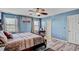 Spacious main bedroom with king bed, ceiling fan, and en-suite bathroom at 1104 Braemar Highland Dr, Zebulon, NC 27597