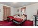 Cozy bedroom with twin beds and floral bedding at 415 N Hyde Park Ave, Durham, NC 27703