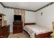 Simple bedroom with floral bedding and a ceiling fan at 415 N Hyde Park Ave, Durham, NC 27703