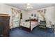 Charming bedroom with floral bedding and a ceiling fan at 415 N Hyde Park Ave, Durham, NC 27703