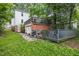House back view with wooden deck and brick addition at 415 N Hyde Park Ave, Durham, NC 27703