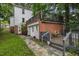 House with brick addition and wooden deck at 415 N Hyde Park Ave, Durham, NC 27703