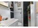 Simple bathroom with white vanity and tiled walls at 415 N Hyde Park Ave, Durham, NC 27703