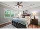 Spacious primary bedroom with large windows and en-suite bathroom at 179 Ivory Ln, Raleigh, NC 27610