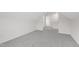 Empty bonus room with gray carpet and vaulted ceilings at 420 Oak Park Blvd, Youngsville, NC 27596