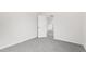 Empty bedroom with gray carpet and open door leading to another room at 420 Oak Park Blvd, Youngsville, NC 27596