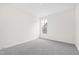 Unfurnished bedroom with gray carpet and single window at 420 Oak Park Blvd, Youngsville, NC 27596