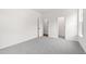 Empty bedroom with gray carpet and white walls at 420 Oak Park Blvd, Youngsville, NC 27596