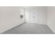 Empty bedroom with gray carpet, white walls, and closet at 420 Oak Park Blvd, Youngsville, NC 27596