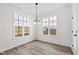 Bright dining area with large windows and wood-look flooring at 420 Oak Park Blvd, Youngsville, NC 27596