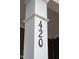 Close-up of the front porch column with house number 420 at 420 Oak Park Blvd, Youngsville, NC 27596