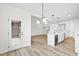 Kitchen with island, stainless steel appliances, and access to the backyard at 420 Oak Park Blvd, Youngsville, NC 27596