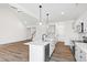 Kitchen island with white countertop, sink, dishwasher, and pendant lighting at 420 Oak Park Blvd, Youngsville, NC 27596