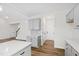 Bright kitchen with gray cabinets, white countertops, and a pantry at 420 Oak Park Blvd, Youngsville, NC 27596