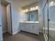 Elegant bathroom with double vanity, hexagon tile, and shower at 607 Hillfarm Dr, Wake Forest, NC 27587