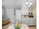 Kitchen features white cabinets, a microwave, and kitchen island at 7017 Jeffreys Creek Ln, Raleigh, NC 27616