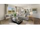Cozy living room with hardwood floors and natural light at 203 Calebs Corner Pl, Spring Lake, NC 28390