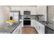Modern kitchen with stainless steel appliances and granite countertops at 203 Calebs Corner Pl, Spring Lake, NC 28390