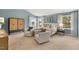 Main bedroom with sitting area and large windows at 203 Calebs Corner Pl, Spring Lake, NC 28390