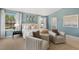 Spacious primary bedroom with sitting area and large windows at 203 Calebs Corner Pl, Spring Lake, NC 28390