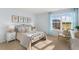 Cozy bedroom with a metal bed frame and window seat at 203 Calebs Corner Pl, Spring Lake, NC 28390