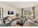Relaxing living room with comfortable seating and large TV at 203 Calebs Corner Pl, Spring Lake, NC 28390