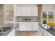 White shaker cabinets and granite countertops in this kitchen at 203 Calebs Corner Pl, Spring Lake, NC 28390