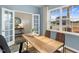 Bright home office with window views and wood desk at 203 Calebs Corner Pl, Spring Lake, NC 28390