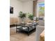 Living room with coffee table and comfortable seating at 203 Calebs Corner Pl, Spring Lake, NC 28390