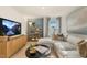 Relaxing bonus room with sectional sofa and large TV at 203 Calebs Corner Pl, Spring Lake, NC 28390