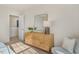 Bedroom with dresser, chair, and access to hallway at 203 Calebs Corner Pl, Spring Lake, NC 28390