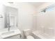 Bathroom with single vanity, bathtub, and a window for natural light at 112 N Guthrie Ave # A, Durham, NC 27703