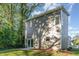 Modern gray house with a sliding glass door and small windows at 112 N Guthrie Ave # A, Durham, NC 27703
