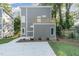 Rear view of a modern two-story home with gray siding and a deck at 112 N Guthrie Ave # A, Durham, NC 27703