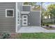 Side view of a modern two-story home with gray siding and a patio at 112 N Guthrie Ave # A, Durham, NC 27703