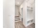 Bright entryway with built-in shelving and stairs leading upstairs at 112 N Guthrie Ave # A, Durham, NC 27703