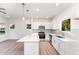 Modern kitchen with white cabinets, quartz countertops, and stainless steel appliances at 112 N Guthrie Ave # A, Durham, NC 27703