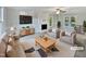 Spacious living room features a fireplace and plenty of natural light at 2504 Timothy Dr, Fuquay Varina, NC 27526