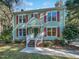 Two story light green house with red shutters at 2504 Timothy Dr, Fuquay Varina, NC 27526