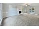 Bright and airy living room with neutral carpeting and fireplace at 2504 Timothy Dr, Fuquay Varina, NC 27526