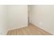 Simple bedroom with wood flooring and an open door at 112 N Guthrie Ave # B, Durham, NC 27703